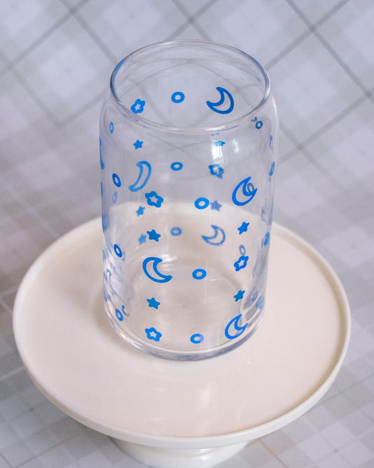 Glass cup with blue vinyl wrap of stars and moons