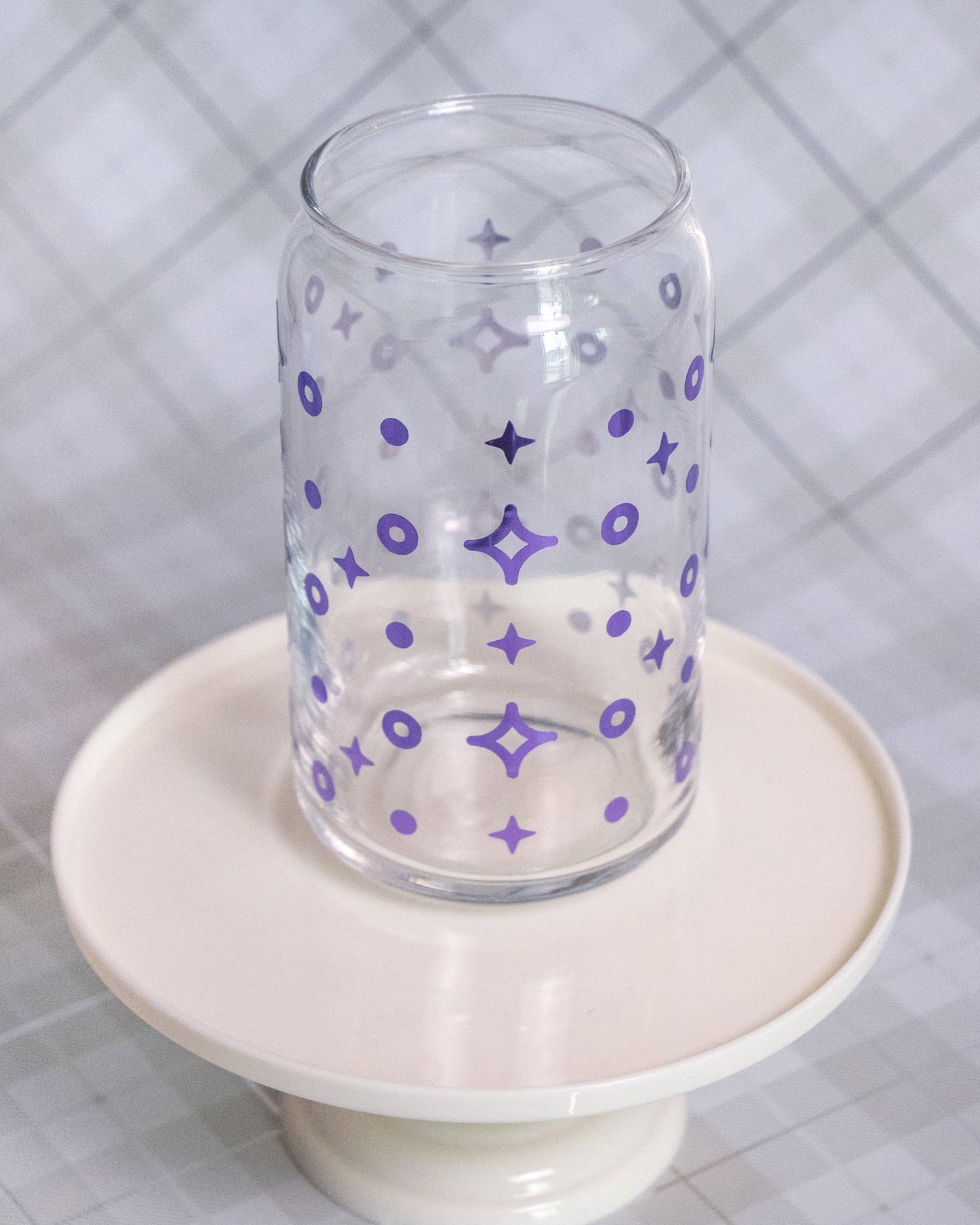 Glass can cup with 4 point star shaped purple vinyl